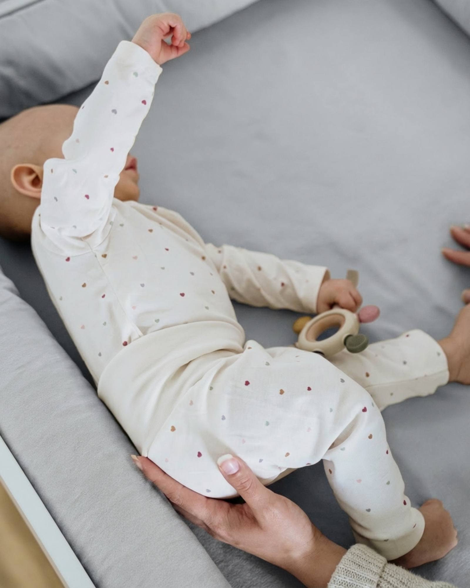 baby, baby clothing, onesie, dots, soft gray background