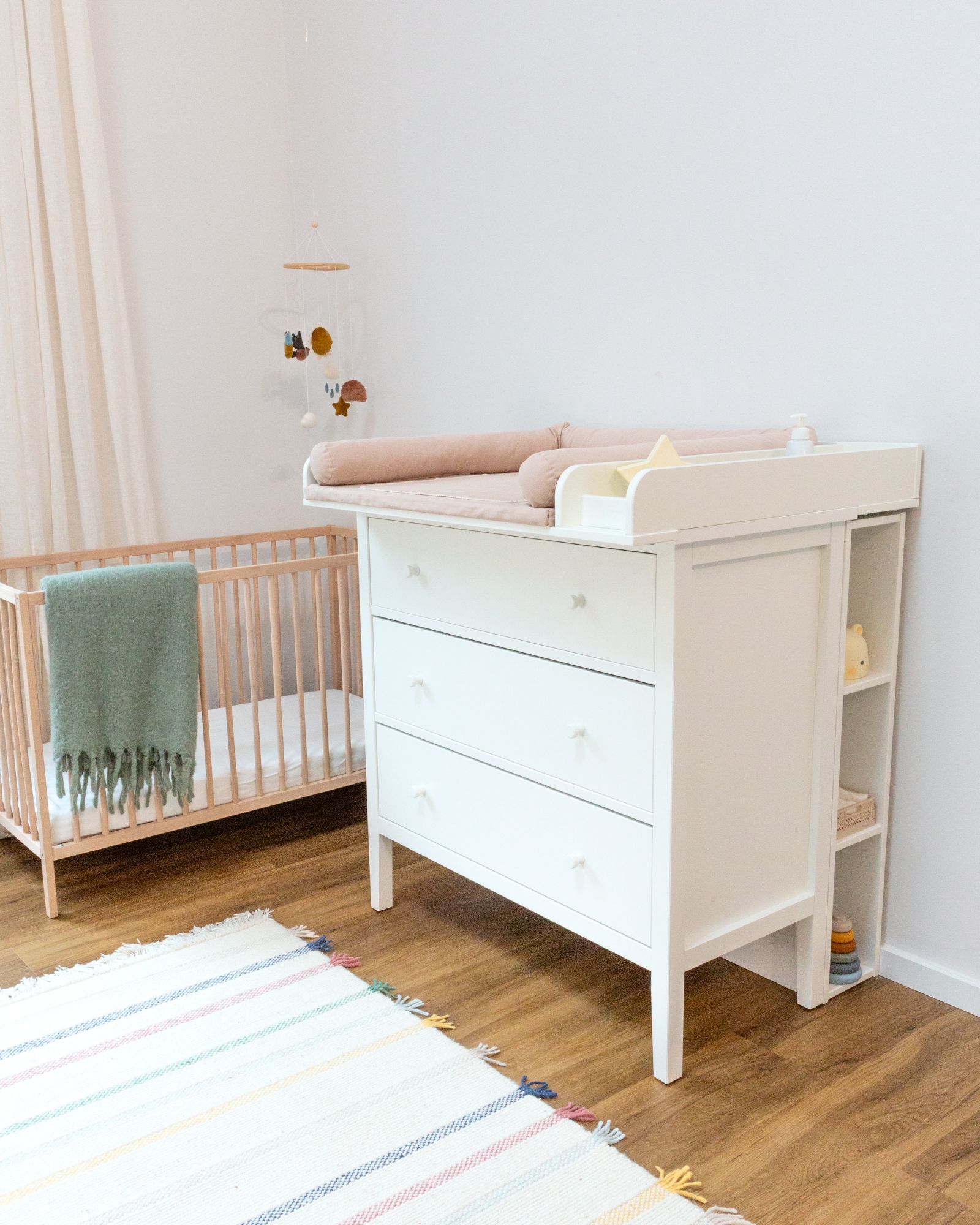 baby-dresser, changing-table, baby-compartment, crib-adjacent-dresser, wooden-floor